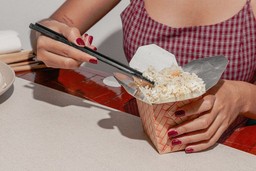 asian-girl-eating-fried-rice-with-chopstick